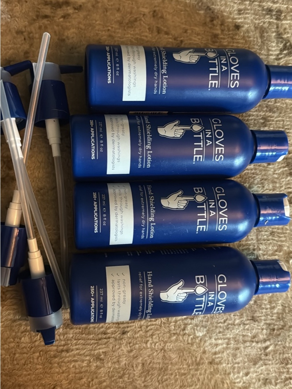 Four pack of 8 ounce Gloves in a Bottle. Each comes with a pump. All are new